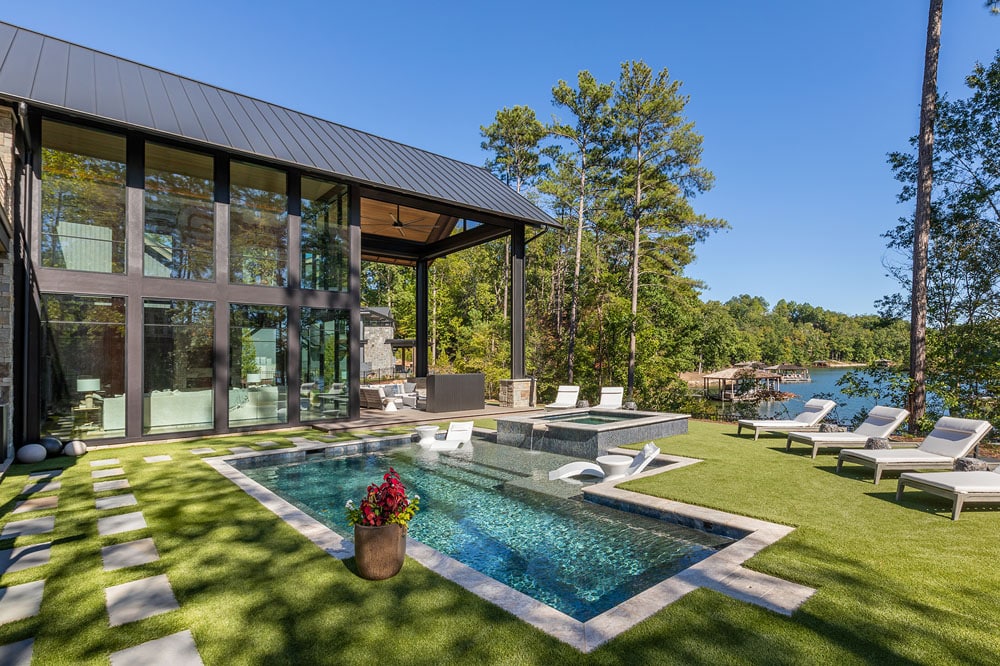 Exterior of home with pool and view of Lake Keowee