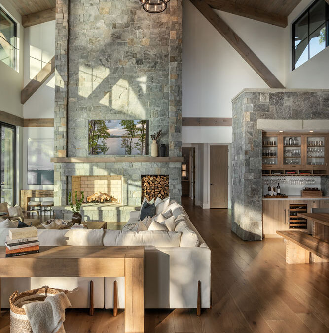 Living room with vaulted ceiling and stone fireplace