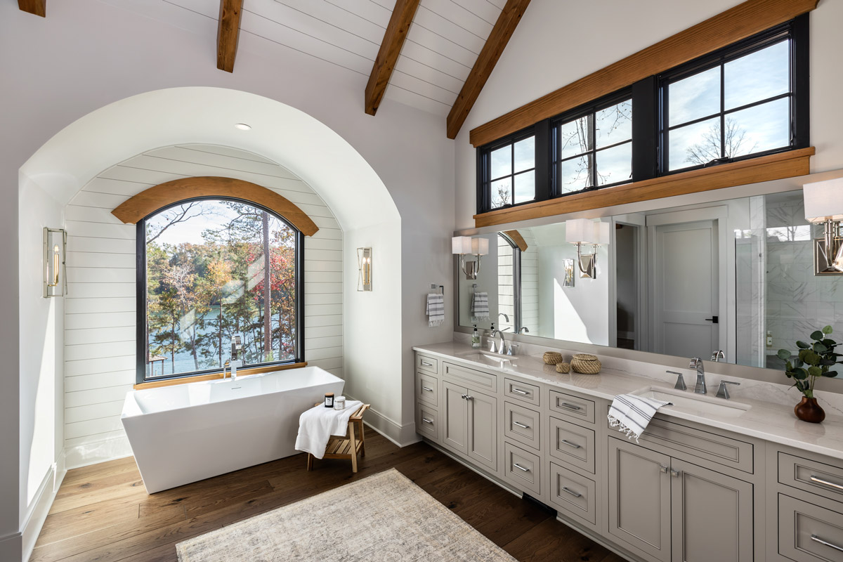 Bathroom with soaking tub and views of Lake Keowee