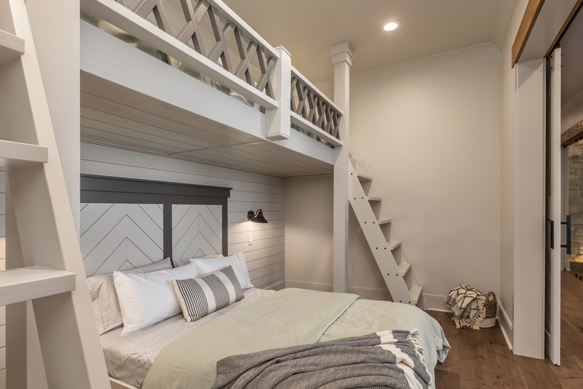 Bunkbeds in bedroom with sliding barn doors