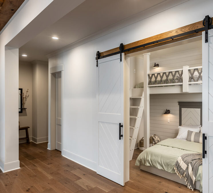 Bunkbeds in bedroom with sliding barn doors