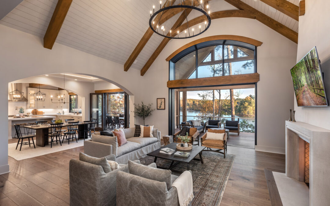 Living room with vaulted ceilings and fireplace with views of Lake Keowee
