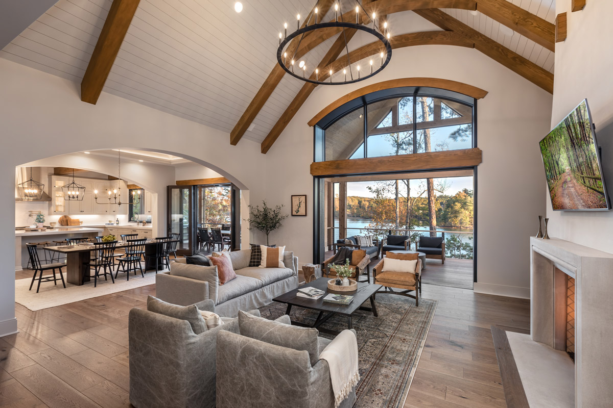 Living room with vaulted ceilings and fireplace with views of Lake Keowee