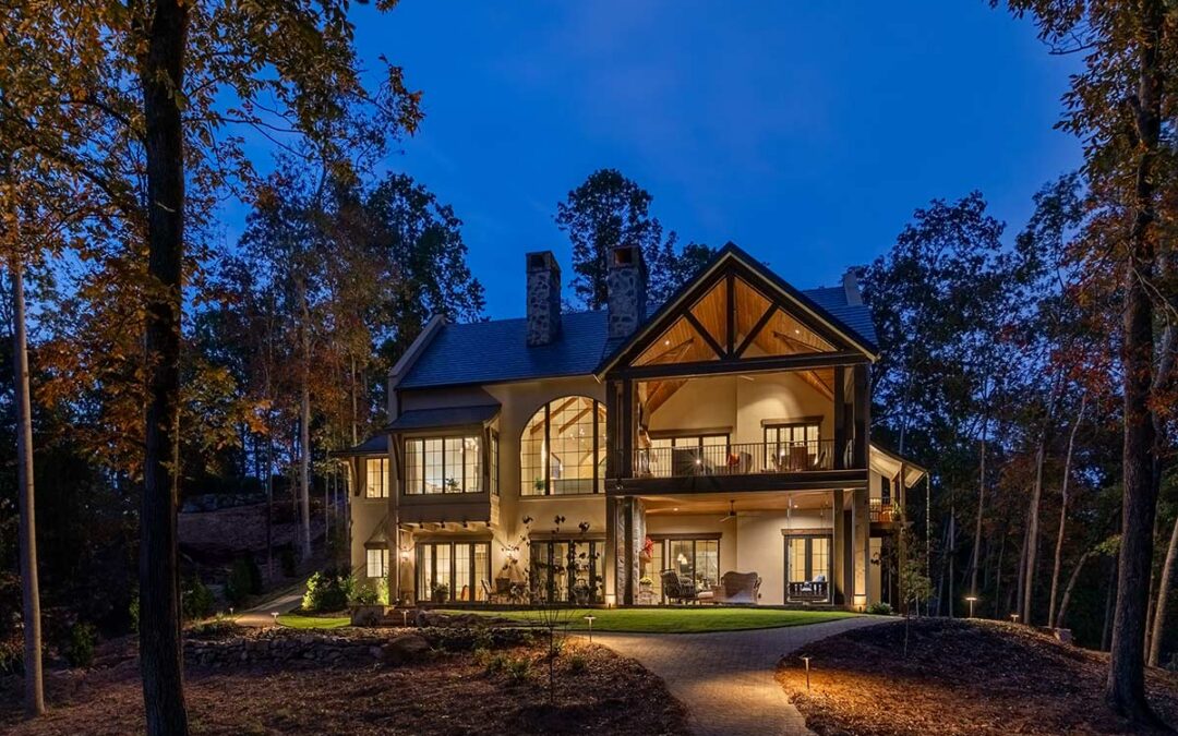 Home as seen at night, with exterior lighting