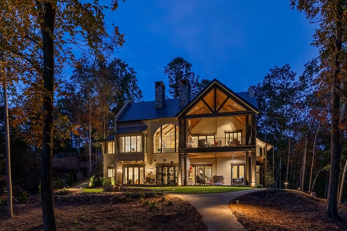 Home as seen at night, with exterior lighting