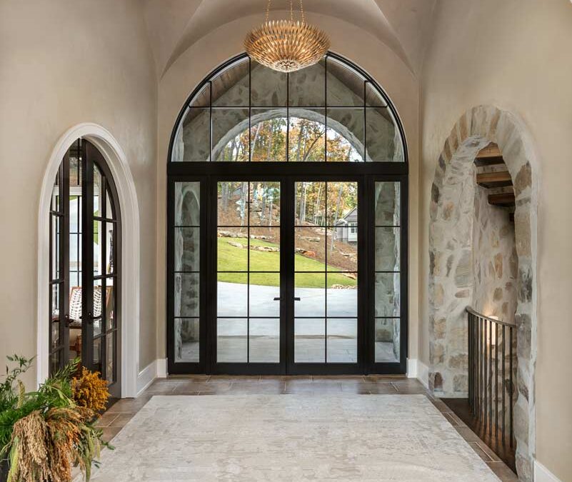 Entrace foyer with stonework and barrel vaulted ceiling