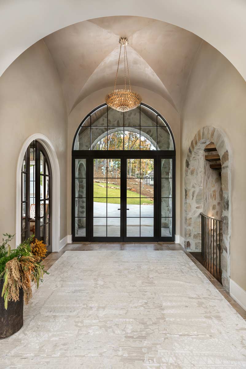 Entrace foyer with stonework and barrel vaulted ceiling