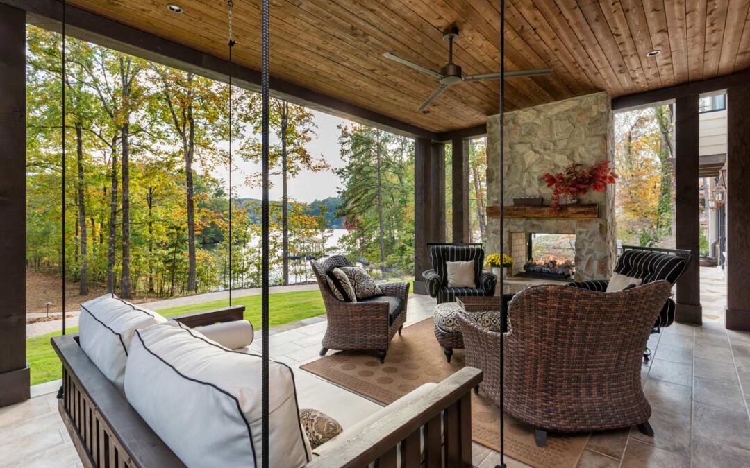 first-floor outdoor living space with fire place and lake views