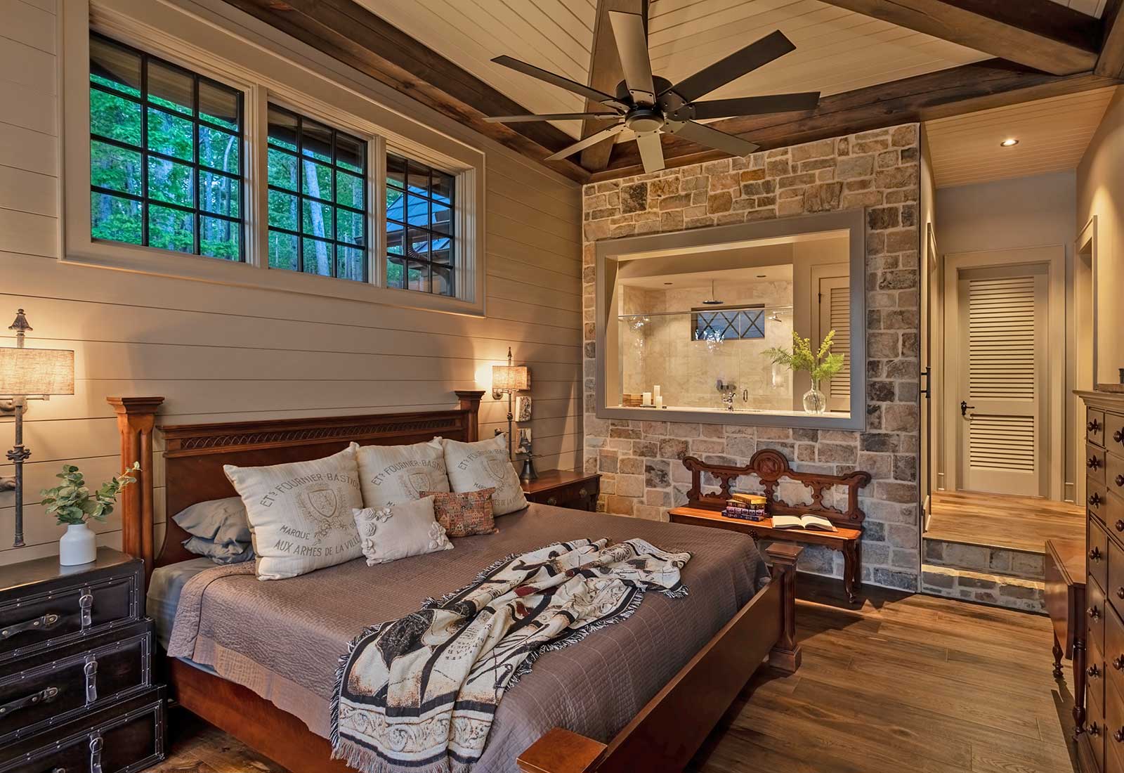 A master bedroom, beadboard walls, stone walls