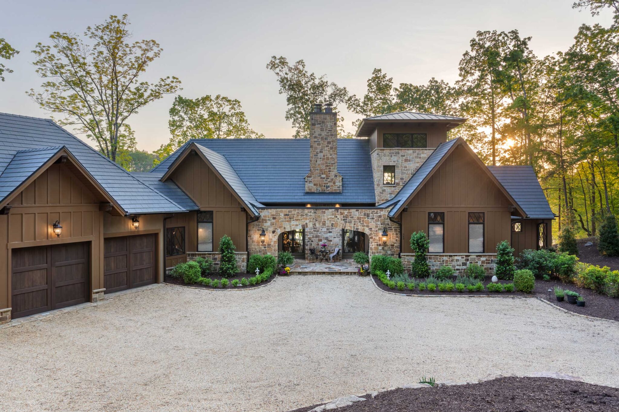 Exterior, stone fascia. Arched entry. Photographed during the evening.