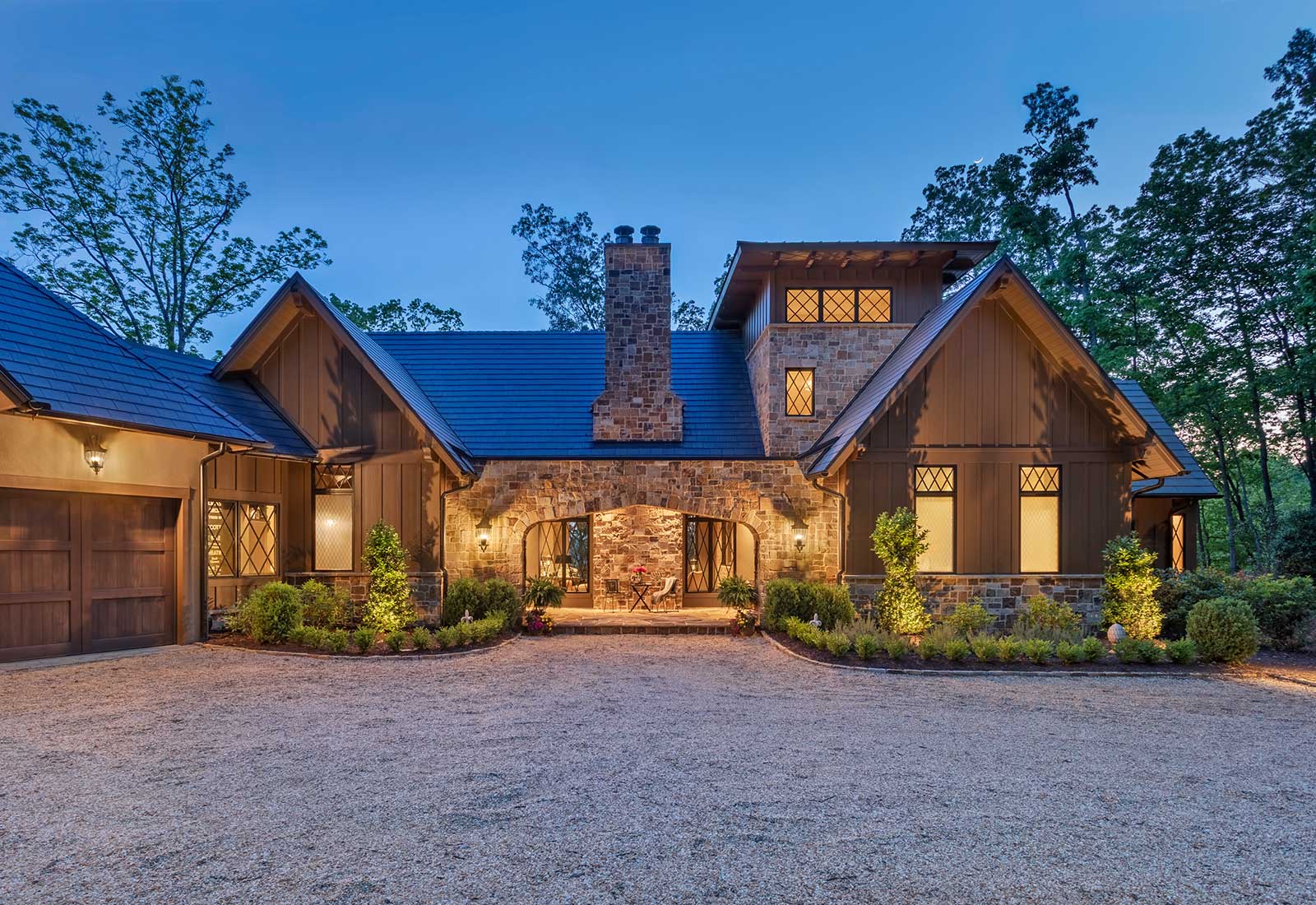 Exterior, stone fascia. Arched entry. Photographed during the evening.
