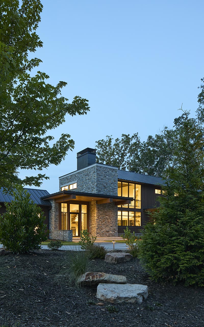 The entry portico as seen at dusk