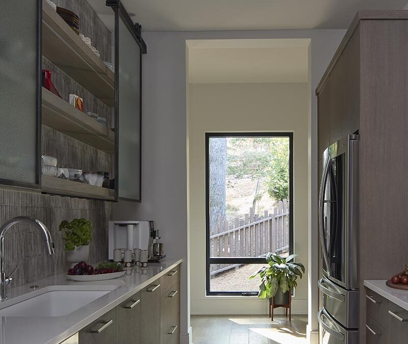 The butler's pantry features custom cabinetry