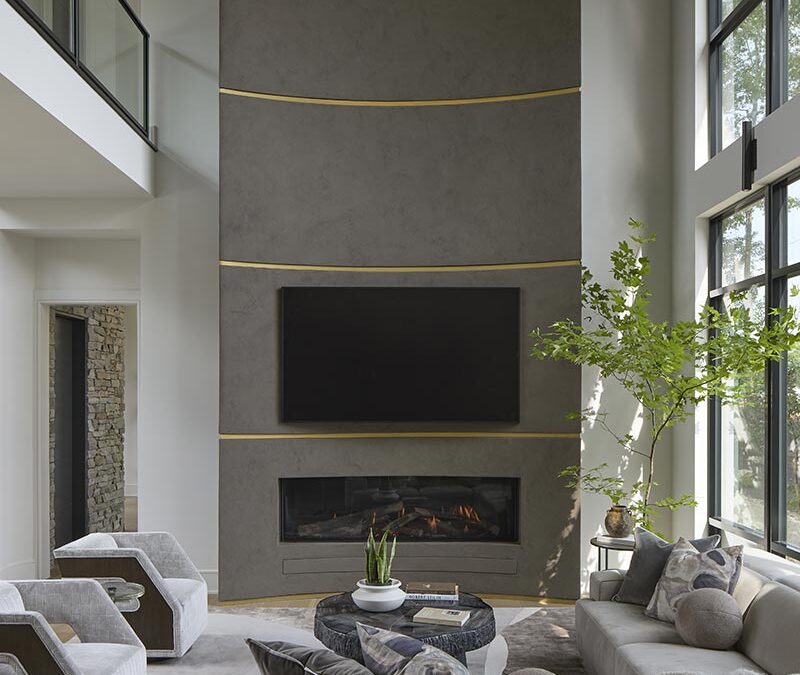 The massive two story fireplace anchors the living room