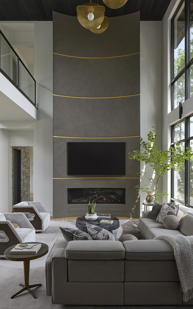 The massive two story fireplace anchors the living room