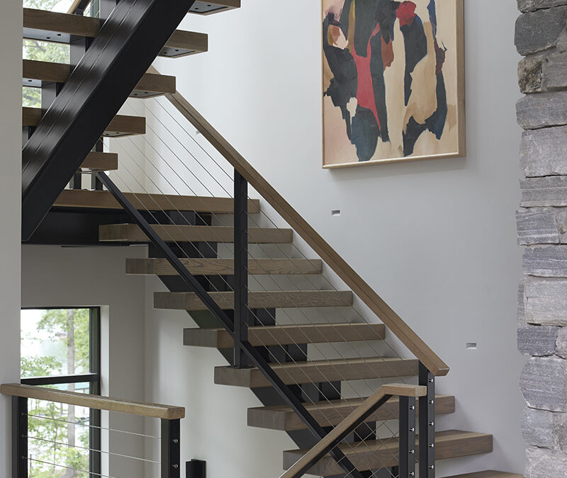 Custom stairs with steel support structure, heaving solid wood steps and cable railings